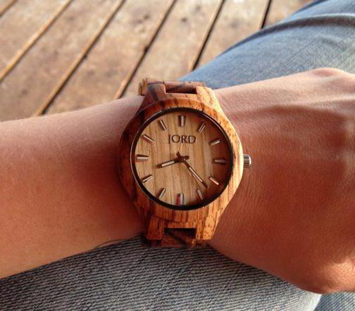 wrist watch in a wooden case
