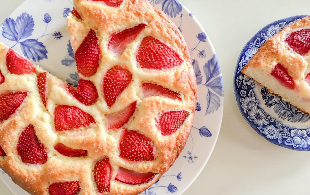 a Simple cake with strawberries on yogurt