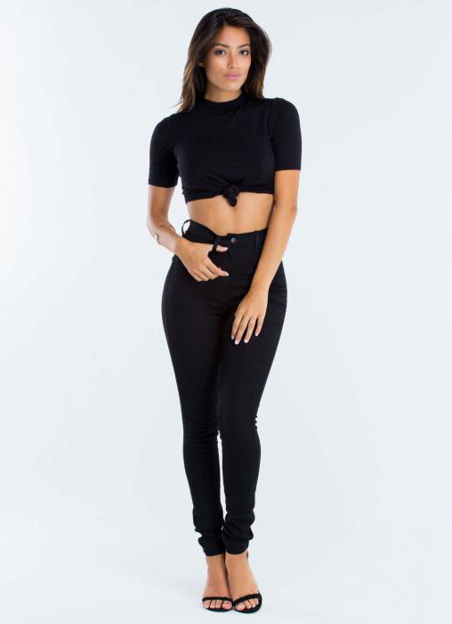 a pair of black jeans with high waist and holes