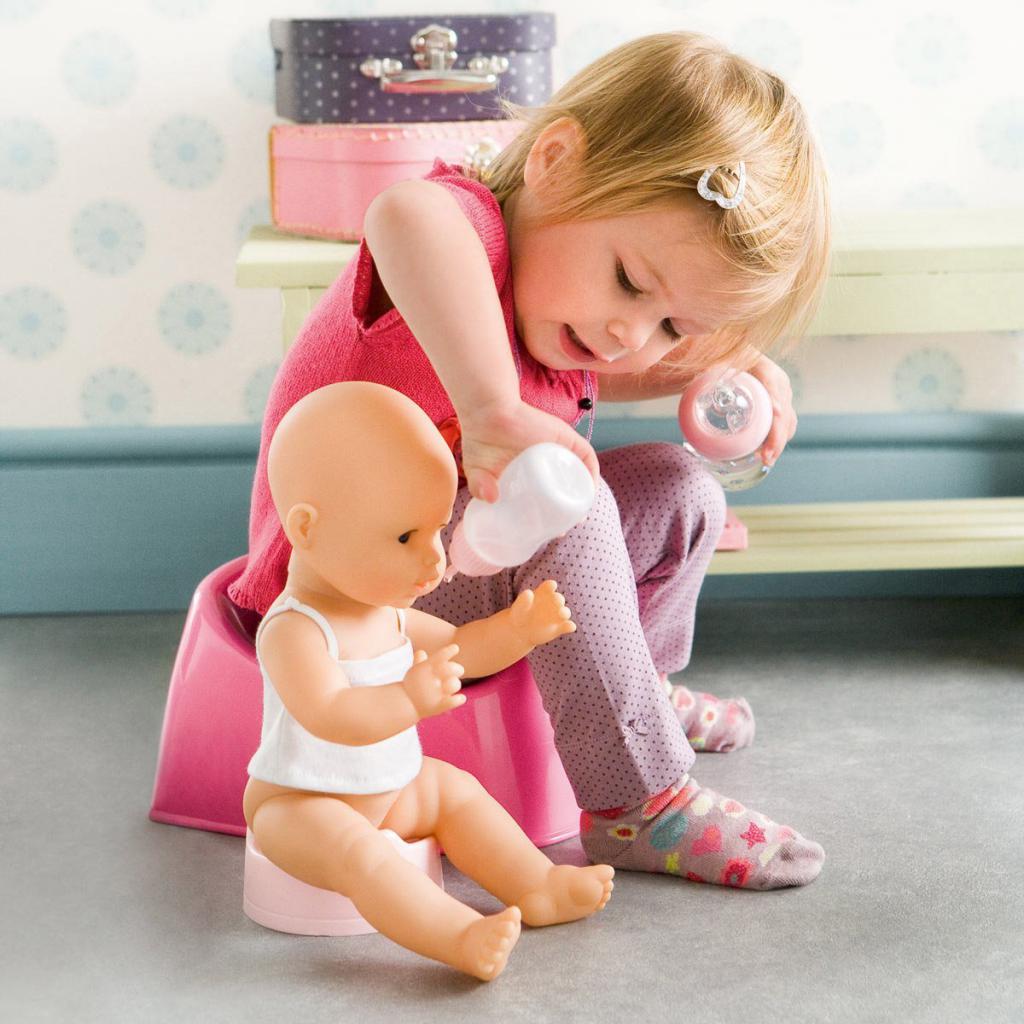 on the potty with a doll