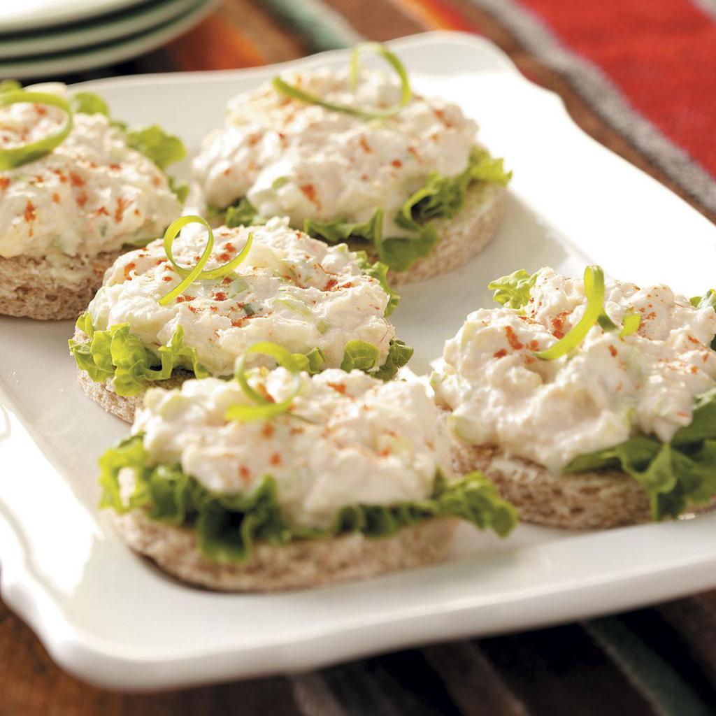 crab salad with greens on the sandwiches
