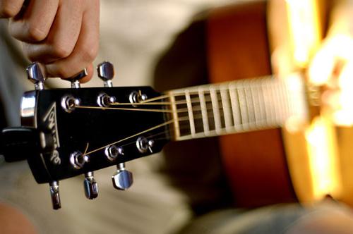 tune your guitar using the tuner