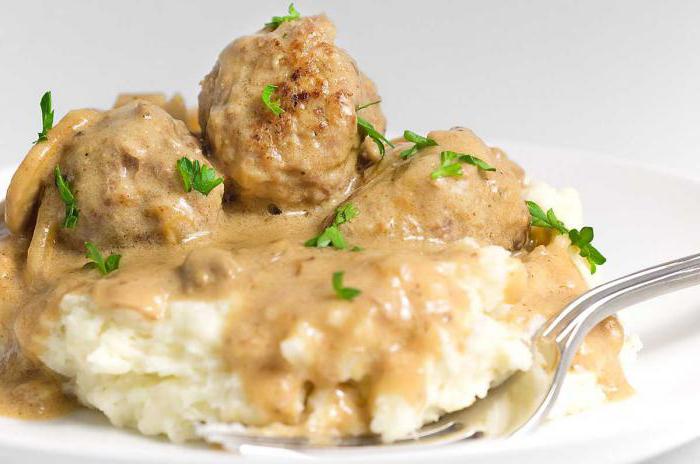 chicken meatballs in a cream sauce in the oven